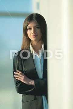 The businesswoman stand over the column Stock Photos