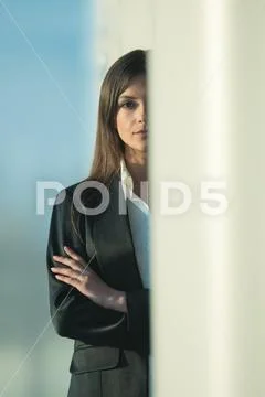 The businesswoman stand over the column Stock Photos
