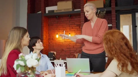 Businesswoman standing while explaining ideas Stock Footage 142322085