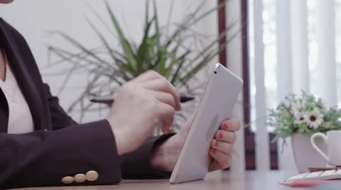 Businesswoman in suit uses graphic tablet to sketch ideas Stock Footage 59747501