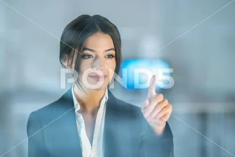 The businesswoman touch the virtual screen Stock Photos