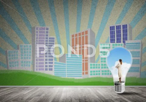 Businesswoman trapped in bulb Stock Photos