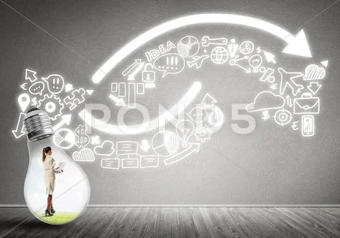Businesswoman trapped in bulb Stock Photos
