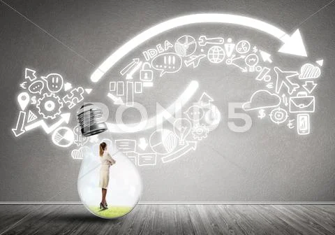 Businesswoman trapped in bulb Stock Photos