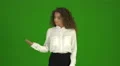The businesswoman try to make a choice and stand on the green background 4k or 4k+ Resolution