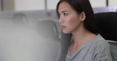Businesswoman using computer in empty office Stock Footage 79136231