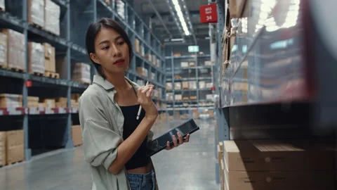Businesswoman using digital tablet checking inventory levels in shopping center. Stock Footage 148899184