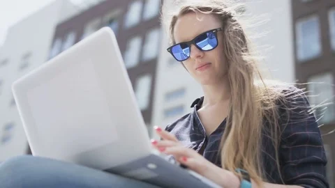 Businesswoman Using a Laptop Computer in the Wind Stock Footage 77332965