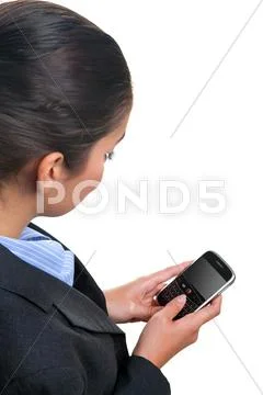 Businesswoman using a mobile device Stock Photos