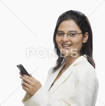 Businesswoman using a mobile phone Stock Photos