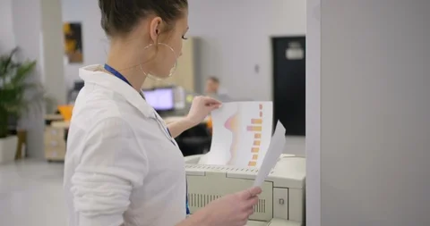 Businesswoman using a printer. Stock Footage 109217334