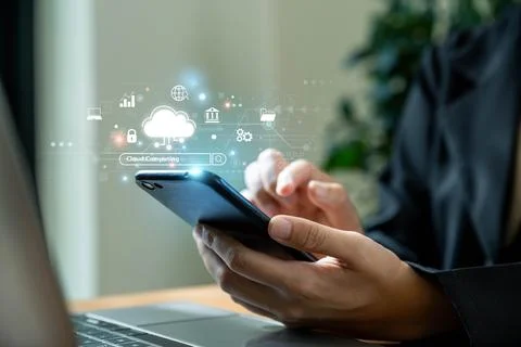Businesswoman using smartphone with cloud computing network. Foto stock