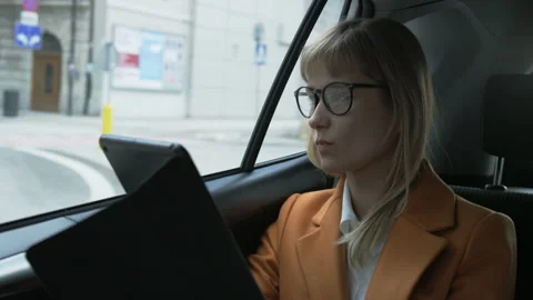 Businesswoman Using a Tablet Computer. The Car Stops Stock Footage 87458487
