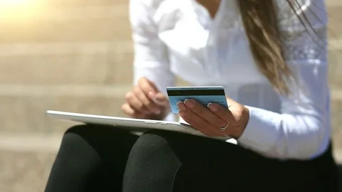 Businesswoman using tablet computer makes online purchase with credit card Video stock 80688884