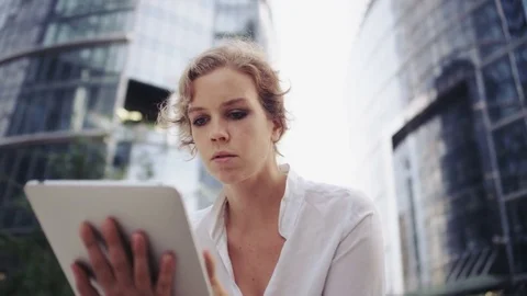 Businesswoman Using a Tablet Computer. Office Buildings Stock Footage 81000276