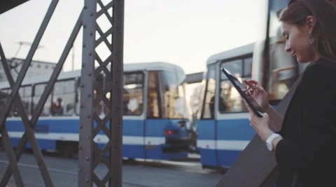 Businesswoman Using Tablet, Going to Work in the City. SLOW MOTION STEADICAM Stock Footage