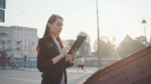 Businesswoman Using Tablet, Going to Work in the City. SLOW MOTION STEADICAM Video stock 67849793