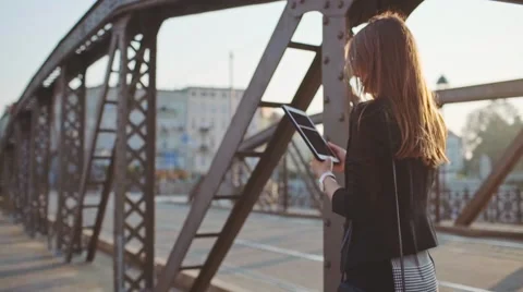 Businesswoman Using Tablet, Going to Work in the City. SLOW MOTION STEADICAM Stock Footage