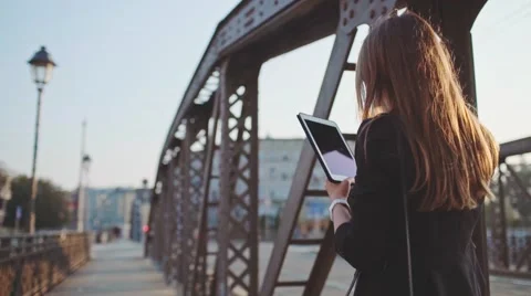 Businesswoman Using Tablet, Going to Work in the City. SLOW MOTION STEADICAM Stock Footage