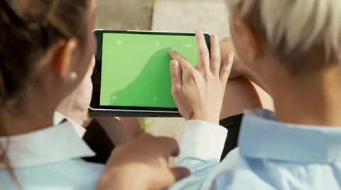 Businesswoman using tablet pc to work near office building Stock Footage 25841346