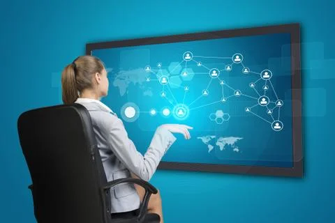 Businesswoman using touch screen interface Stock Photos