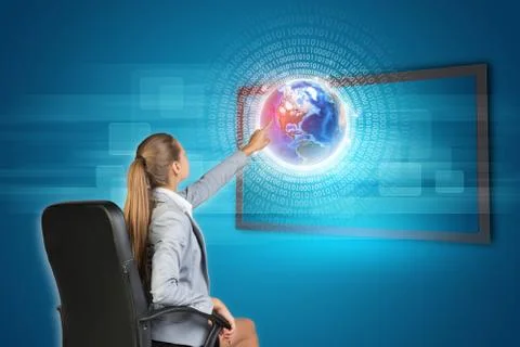 Businesswoman using touch screen interface Foto stock