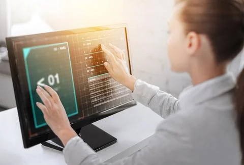 Businesswoman with virtual data on computer screen Stock Photos