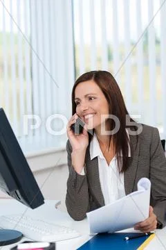 Businesswoman working and chatting on her mobile Stock Photos