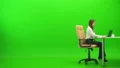 The businesswoman working with a laptop at the table on the green background 4k or 4k+ Resolution