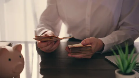 Businesswoman's hands meticulously counting stack of fifty euro banknotes a.. Stock Footage 337178101