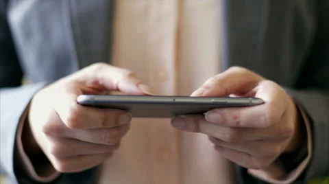 Businesswoman's hands text messaging on smart phone at office Stock Footage 54990680