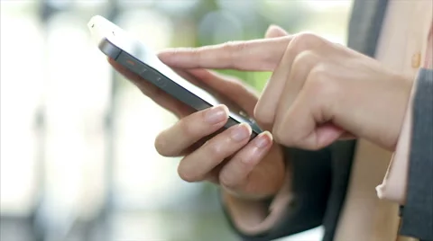 Businesswoman's hands using smart phone in office Stock Footage 54990217