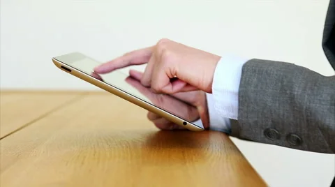 Businesswoman's hands using tablet PC at desk Stock Footage 53489772