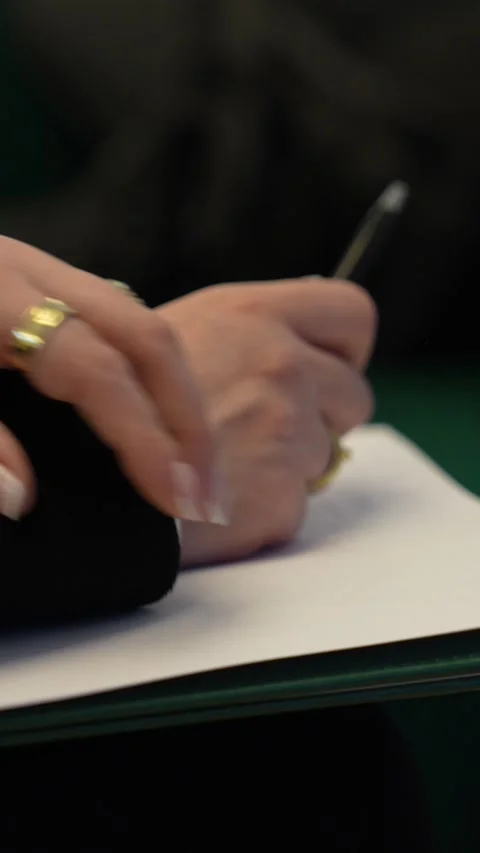 Businesswoman's hands writing notes on paper at meeting Stock Footage 336000298