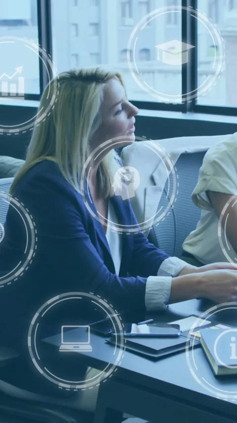 Businesswomen working on computer, surrounded by digital information icons Stock Footage 342954450
