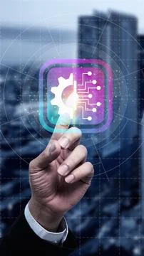 Businness hand touching a glowing digital icon featuring a gear and circuit.. Stock Photos