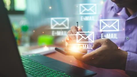 Businssman using smartphone sends and receives email with envelopes icon fo.. Stock Photos