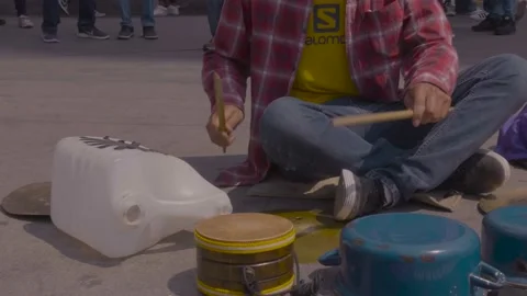 Busker with pans  Stock Footage 203906411