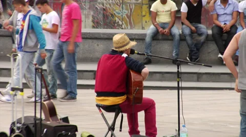 Busker playing on the Alexanderplatz, Berlin, Germany. Stock Footage 32414848