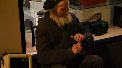 Busker playing the spoons in Bury St Edmunds, Suffolk Stock Footage 86314846