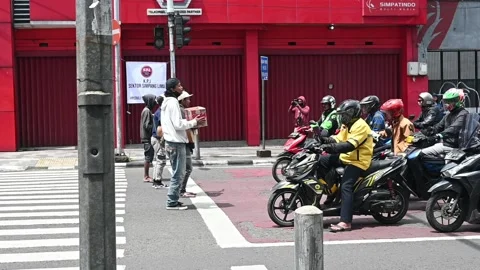 Buskers at traffic light intersections, Bandung, Indonesia. Stock Footage 224249470