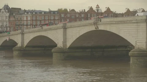 Busses driving over Putney bridge at river Thames, London Stock Footage 146455456
