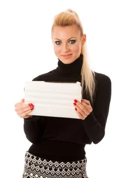 Bussiness woman using tablet computer, reading news and smiling. Stock Photos