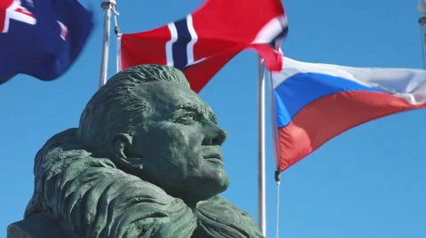 Bust of Admiral Byrd and flags, McMurdo Base, Ross Island, Antarctica Stock Footage 39995075