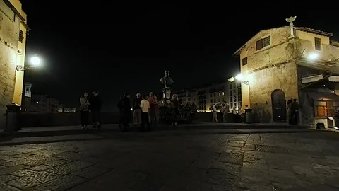 Bust of Benvenuto Cellini in Ponte Vecchio at night in 4k Stock Footage 103464067