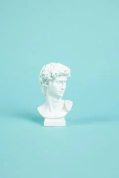 Bust of David on a turquoise background Stock Photos