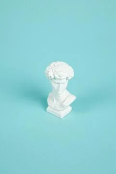 Bust of David on a turquoise background Stock Photos