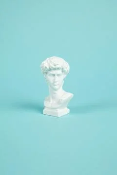 Bust of David on a turquoise background Stock Photos