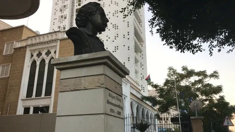 Bust of a man under a tall building in Nicosia Stock Footage 90466704