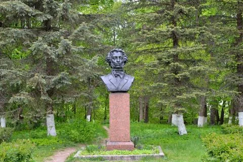 Bust monument to A. S. Pushkin among the firs Stock Photos
